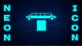 Glowing neon Luxury limousine car and carpet icon isolated on brick wall background. For world premiere celebrities and