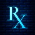 Glowing neon Medicine symbol Rx prescription icon isolated on brick wall background. Vector