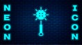 Glowing neon Medieval chained mace ball icon isolated on brick wall background. Medieval weapon. Vector