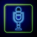 Glowing neon Microphone icon isolated on blue background. On air radio mic microphone. Speaker sign. Vector Illustration Royalty Free Stock Photo