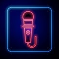 Glowing neon Microphone icon isolated on blue background. On air radio mic microphone. Speaker sign. Vector Illustration Royalty Free Stock Photo