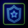 Glowing neon Military reward medal icon isolated on blue background. Army sign. Vector