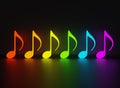 Glowing neon music notes of rainbow colors placed on black glossy background. Concept of party, celebration. Reflection on the Royalty Free Stock Photo
