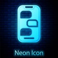 Glowing neon New chat messages notification on phone icon isolated on brick wall background. Smartphone chatting sms Royalty Free Stock Photo