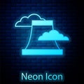 Glowing neon Nuclear power plant icon isolated on brick wall background. Energy industrial concept. Vector