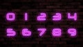 Glowing neon number signs on brick wall