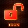 Glowing neon Open padlock icon isolated on brick wall background. Opened lock sign. Cyber security concept. Digital data Royalty Free Stock Photo