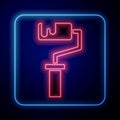 Glowing neon Paint roller brush icon isolated on black background. Vector Royalty Free Stock Photo