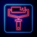 Glowing neon Paint roller brush icon isolated on black background. Vector Royalty Free Stock Photo