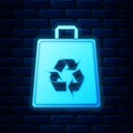 Glowing neon Paper shopping bag with recycle icon isolated on brick wall background. Bag with recycling symbol. Vector Royalty Free Stock Photo