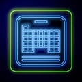 Glowing neon Periodic table of the elements icon isolated on blue background. Vector