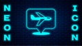 Glowing neon Plane icon isolated on brick wall background. Flying airplane icon. Airliner sign. Vector Royalty Free Stock Photo