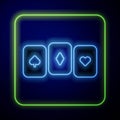 Glowing neon Playing cards icon isolated on blue background. Casino gambling