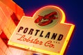 The glowing neon of the Portland Lobster Company sign