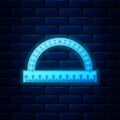 Glowing neon Protractor grid for measuring degrees icon isolated on brick wall background. Tilt angle meter. Measuring Royalty Free Stock Photo