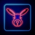 Glowing neon Rabbit head icon isolated on blue background. Vector Royalty Free Stock Photo