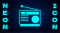 Glowing neon Radio with antenna icon isolated on brick wall background. Vector Royalty Free Stock Photo