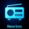 Glowing neon Radio with antenna icon isolated on brick wall background. Vector Royalty Free Stock Photo