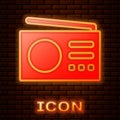 Glowing neon Radio with antenna icon isolated on brick wall background. Vector Royalty Free Stock Photo