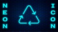 Glowing neon Recycle symbol icon isolated on brick wall background. Circular arrow icon. Environment recyclable go green. Vector Royalty Free Stock Photo