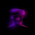 Glowing neon reflex on a female face with virtual glasses on a black background