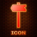 Glowing neon Road traffic sign. Signpost icon isolated on brick wall background. Pointer symbol. Isolated street Royalty Free Stock Photo