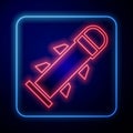 Glowing neon Rocket icon isolated on blue background. Vector Royalty Free Stock Photo