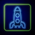 Glowing neon Rocket ship icon isolated on blue background. Space travel. Vector Royalty Free Stock Photo