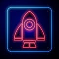 Glowing neon Rocket ship icon isolated on blue background. Space travel. Vector Royalty Free Stock Photo