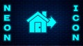 Glowing neon Sale house icon isolated on brick wall background. Buy house concept. Home loan concept, rent, buying a Royalty Free Stock Photo