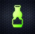 Glowing neon Sauce bottle icon isolated on brick wall background. Ketchup, mustard and mayonnaise bottles with sauce for Royalty Free Stock Photo