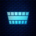 Glowing neon Sauna bucket icon isolated on brick wall background. Vector