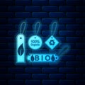 Glowing neon Set of banners, labels, tags, logos for eco green healthy foods icon isolated on brick wall background