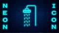 Glowing neon Shower head with water drops flowing icon isolated on brick wall background. Vector Royalty Free Stock Photo