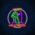 Glowing neon sign of halloween banner design with bony hand from grave. Bright halloween night scary sign neon style.