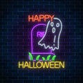 Glowing neon sign of halloween banner design with ghost from grave. Bright halloween scary wraith sign in neon style.