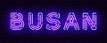 Glowing neon sign with the inscription of the Korean city of Busan.