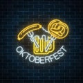 Glowing neon sign of oktoberfest festival with beer mug, sausage and pretzel. Beer autumn fest logo.