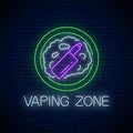 Glowing neon sign of vaping zone on dark brick wall background. Vape kit area symbol. Signboard of smoking place