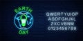 Glowing neon sign of world earth day with globe symbol and green led light bulb with alphabet. Earth day neon banner Royalty Free Stock Photo