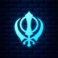 Glowing neon Sikhism religion Khanda symbol icon isolated on brick wall background. Khanda Sikh symbol