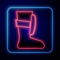 Glowing neon Sport boxing shoes icon isolated on black background. Wrestling shoes. Vector