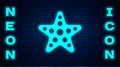 Glowing neon Starfish icon isolated on brick wall background. Vector Royalty Free Stock Photo