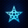 Glowing neon Starfish icon isolated on brick wall background. Vector Royalty Free Stock Photo