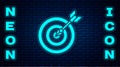 Glowing neon Target with arrow icon isolated on brick wall background. Dart board sign. Archery board icon. Dartboard