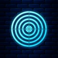 Glowing neon Target sport for shooting competition icon isolated on brick wall background. Clean target with numbers for