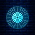 Glowing neon Target sport for shooting competition icon isolated on brick wall background. Clean target with numbers for