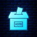Glowing neon Vote box or ballot box with envelope icon isolated on brick wall background. Vector