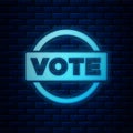 Glowing neon Vote icon isolated on brick wall background. Vector