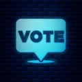 Glowing neon Vote icon isolated on brick wall background. Vector